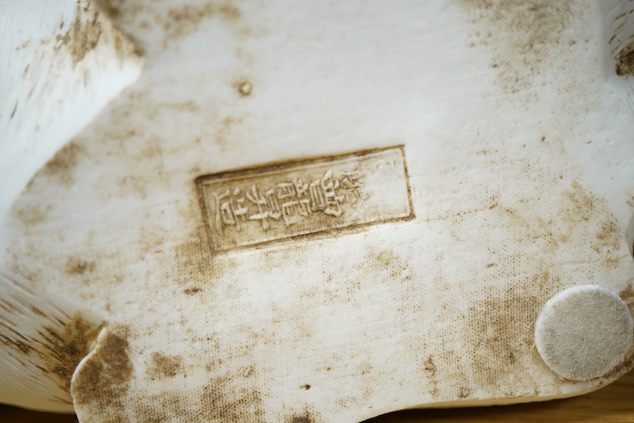 A Chinese Shiwan pottery pod shaped 'frog' vase - 32cm high including stand and a biscuit buffalo group (2)